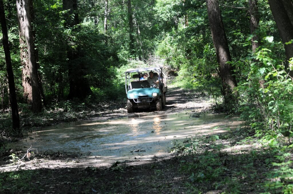 All-terrain vehicle on a muddy damaged trail; image not of a Pennsylvania hiking trail
