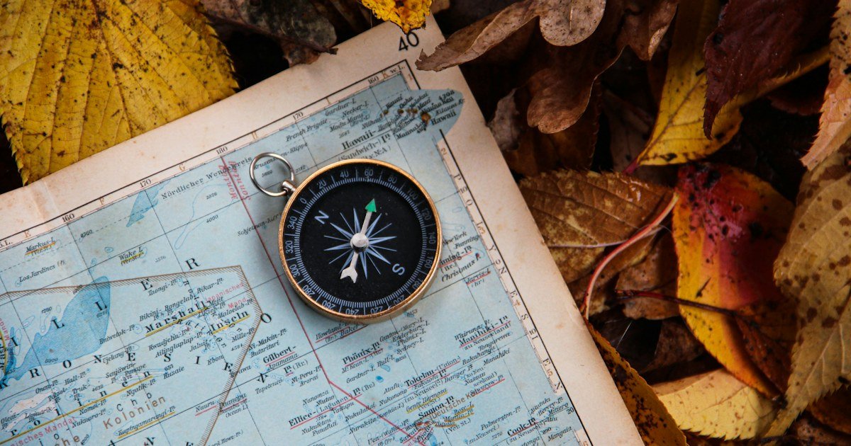Map and compass illustrating offline hiking navigation